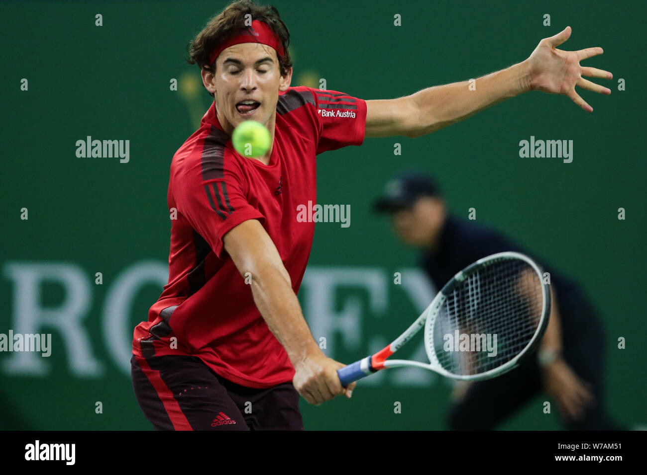 Dominic Thiem Of Austria Returns A Shot To Viktor Troicki Of