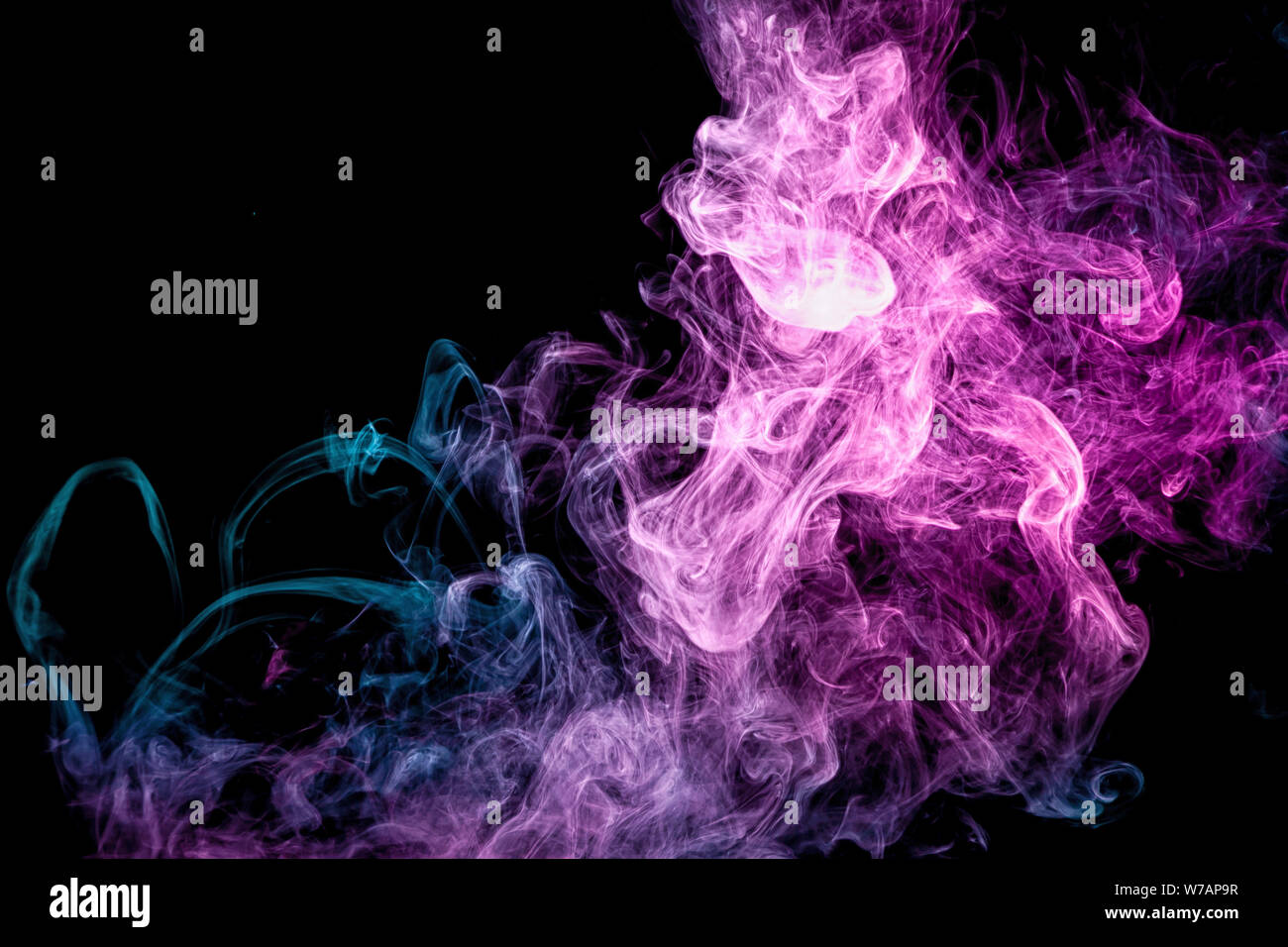 Blue and pink bomb smoke on black isolated background Stock Photo - Alamy