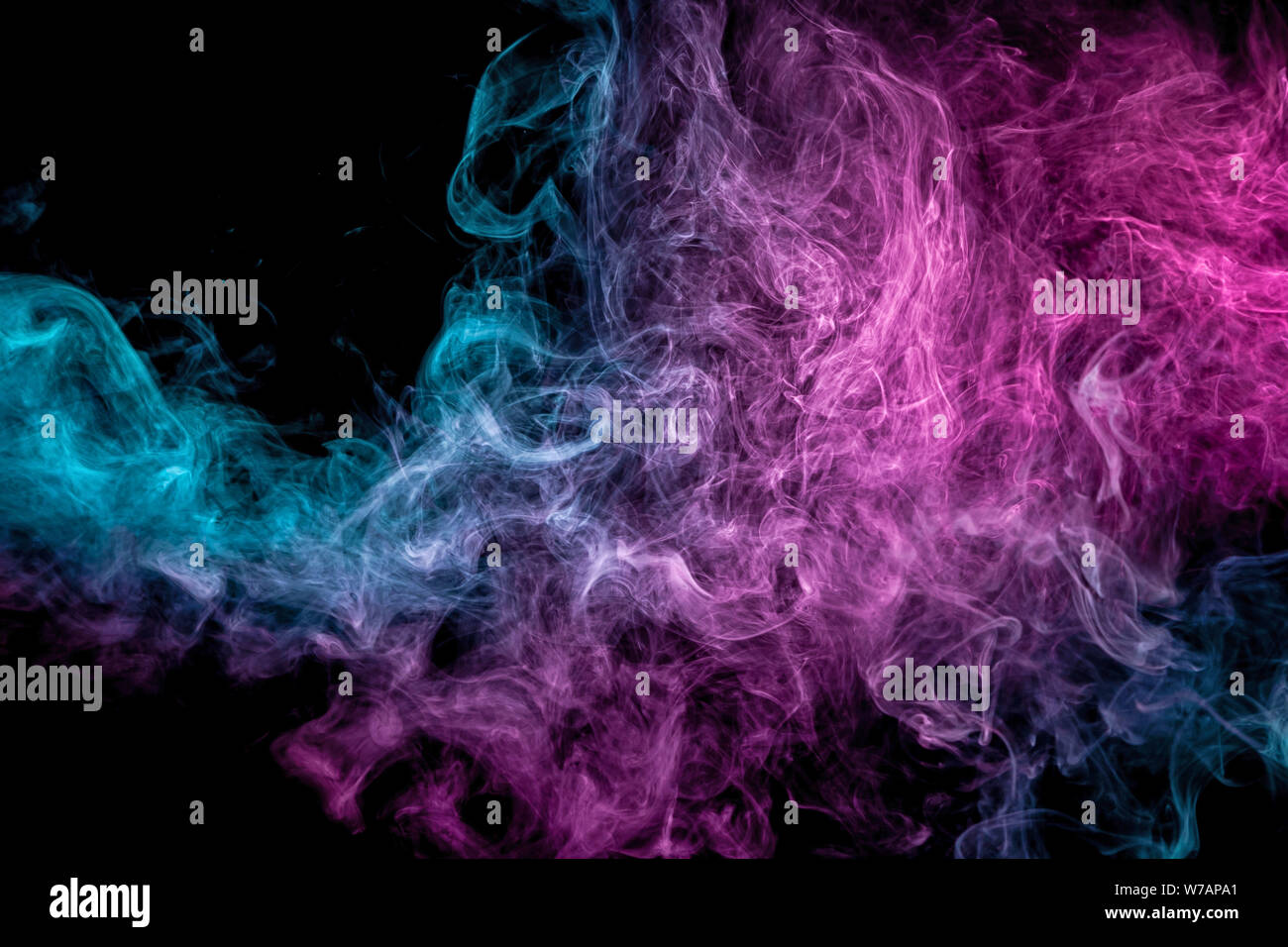 Blue and pink bomb smoke on black isolated background Stock Photo - Alamy