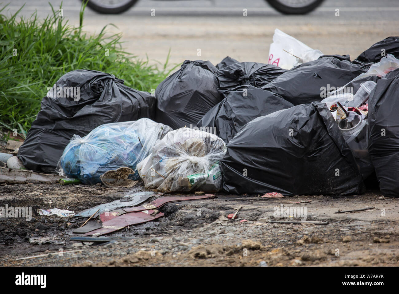 Pile of Garbage plastic black and trash bag waste many on the side