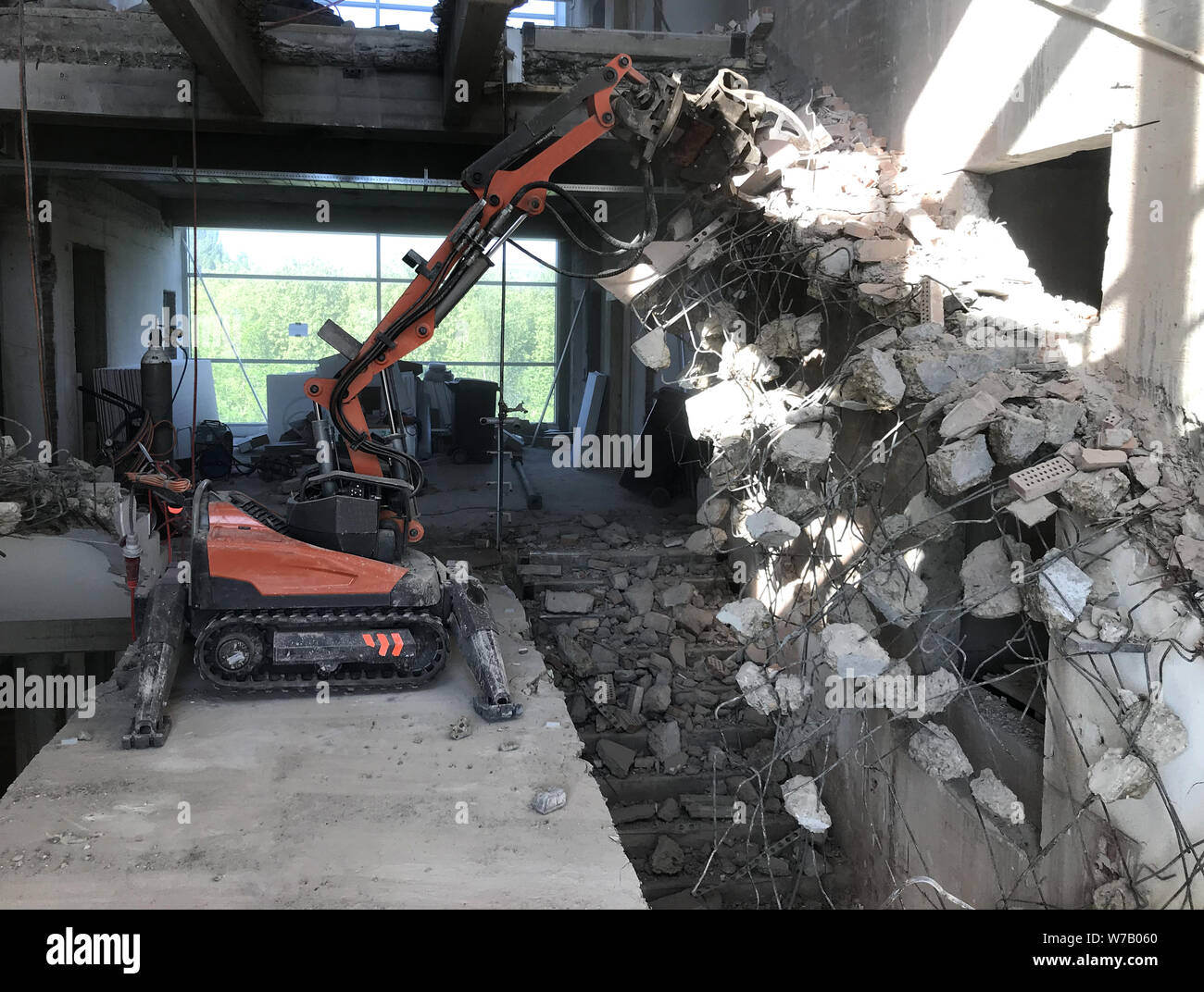 building demolition and  work of dismantling building demolition and hammer machine Stock Photo