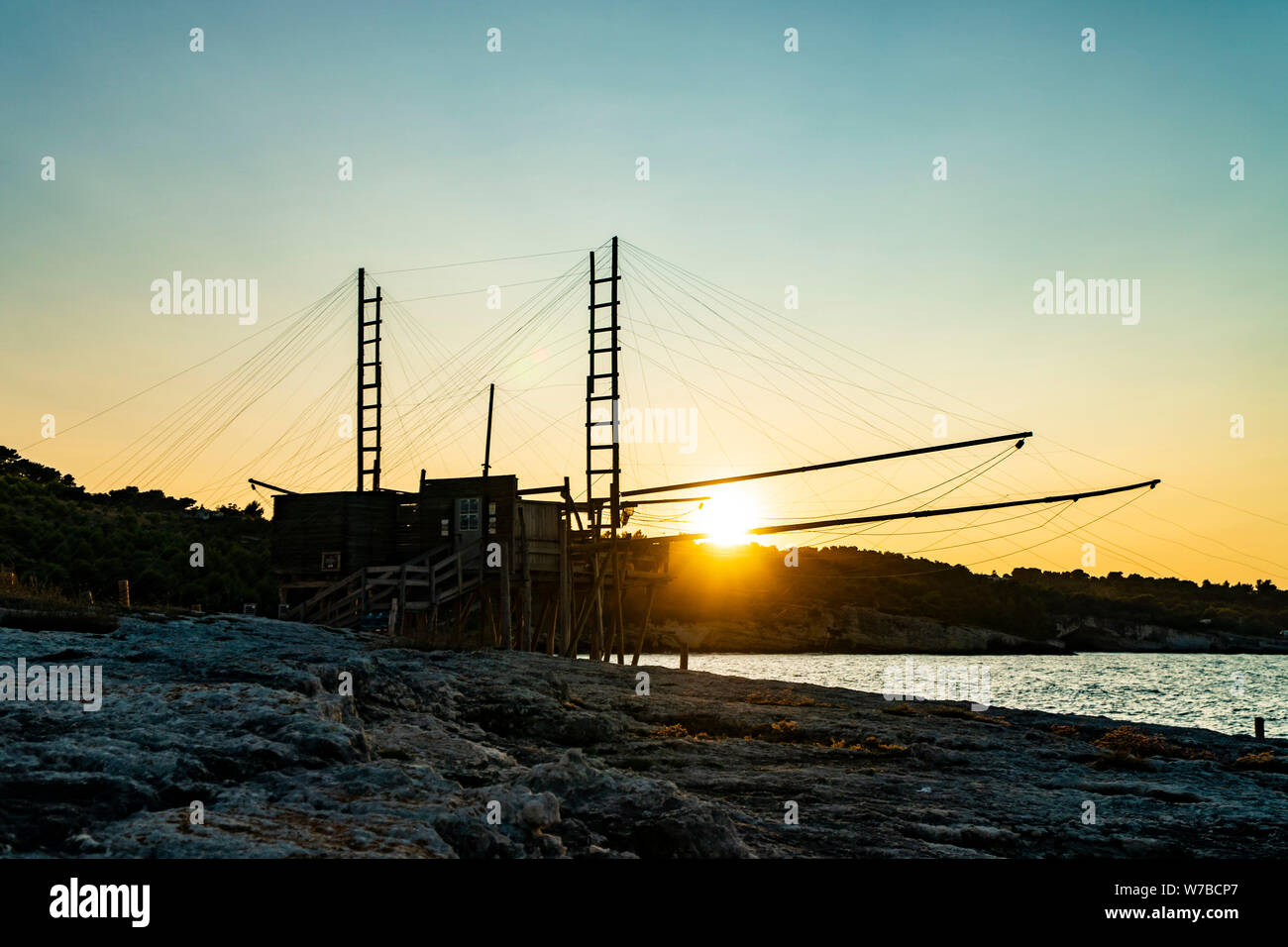 Beautiful seascape with a view of a trabucco at sunset in Italy Stock Photo