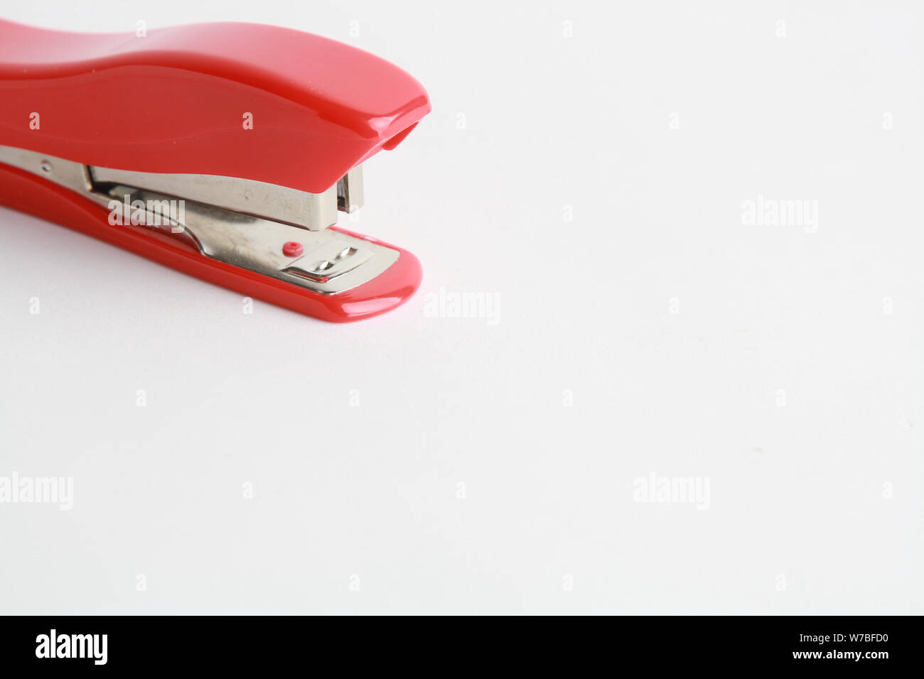 red stapler on white background Stock Photo Alamy