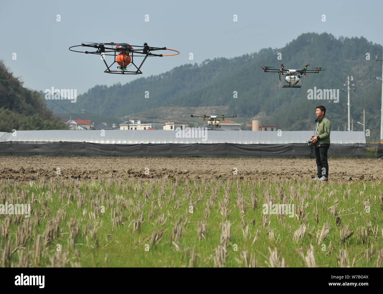 FILE--A Chinese farmer operates his crop-dusting drone at a wheat field in  Tianmushan township, Lin'an city, east China's Zhejiang province, 29 Marc  Stock Photo - Alamy