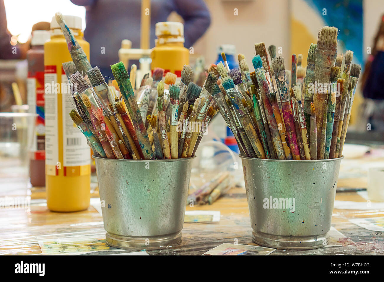 Set of paintbrushes multicolored on the cup. Paint brushes and paints