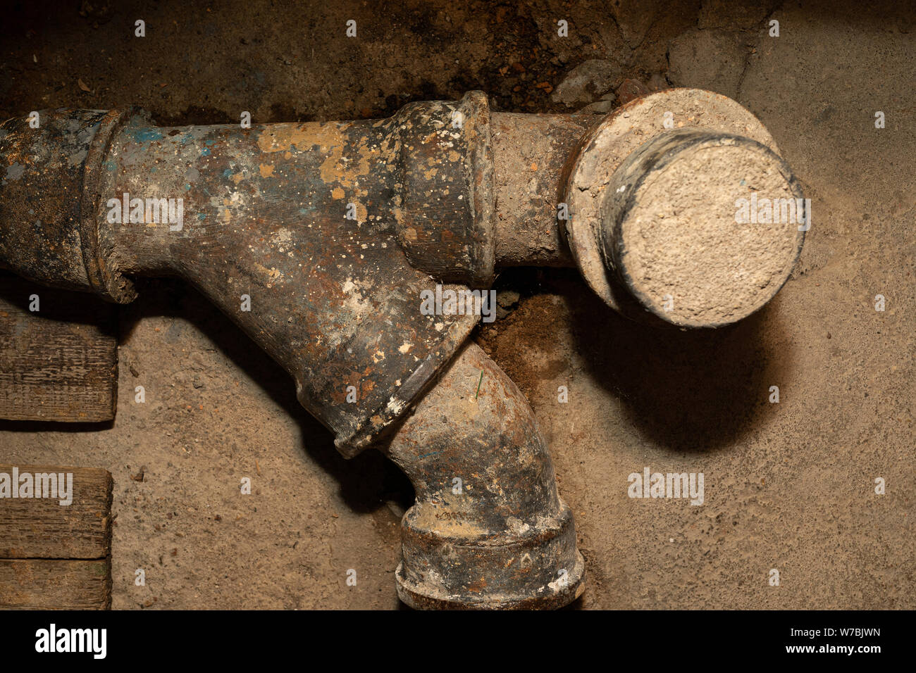 Worn out rusty water pipe in a concrete wall Stock Photo Alamy