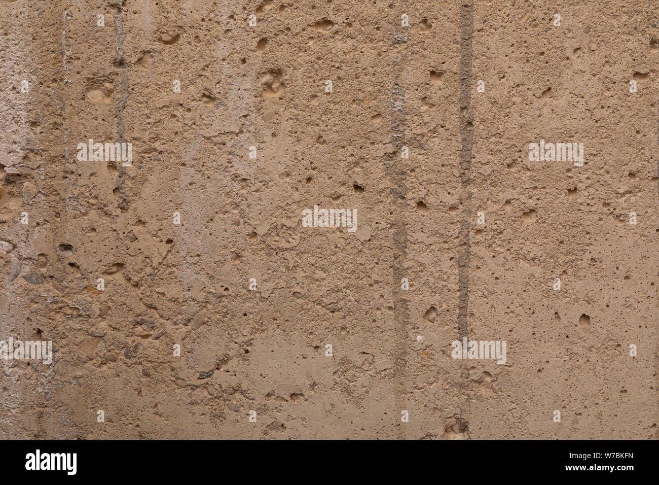 A beige old uneven plastered wall Stock Photo - Alamy
