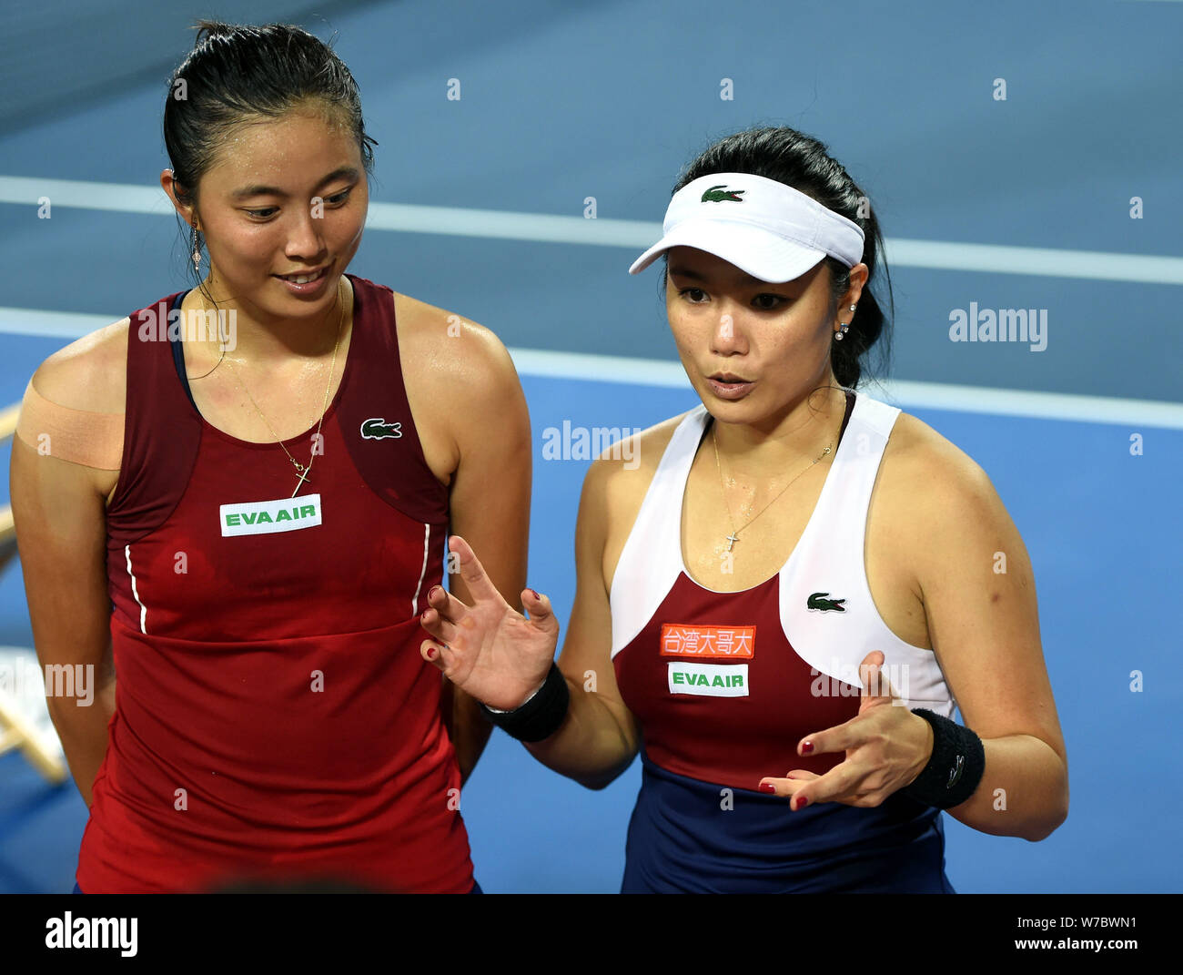 Chan Hao-Ching, left, and Chan Yung-Jan of Chinese Taipei are interviewed by journalists after winning the final match of women's doubles against Wang Stock Photo