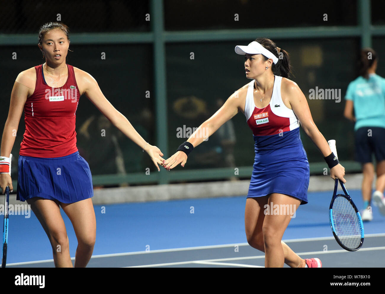 Chan Hao-Ching, left, celebrates with Chan Yung-Jan of Chinese Taipei as they compete against Wang Qiang and Lu Jiajing of China in their final match Stock Photo