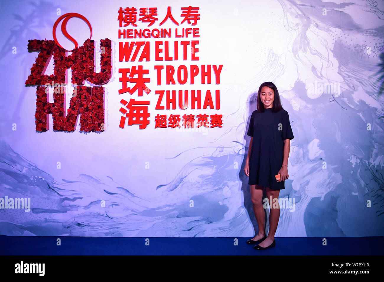 Chinese tennis player Zhang Shuai poses as she arrives at the reception