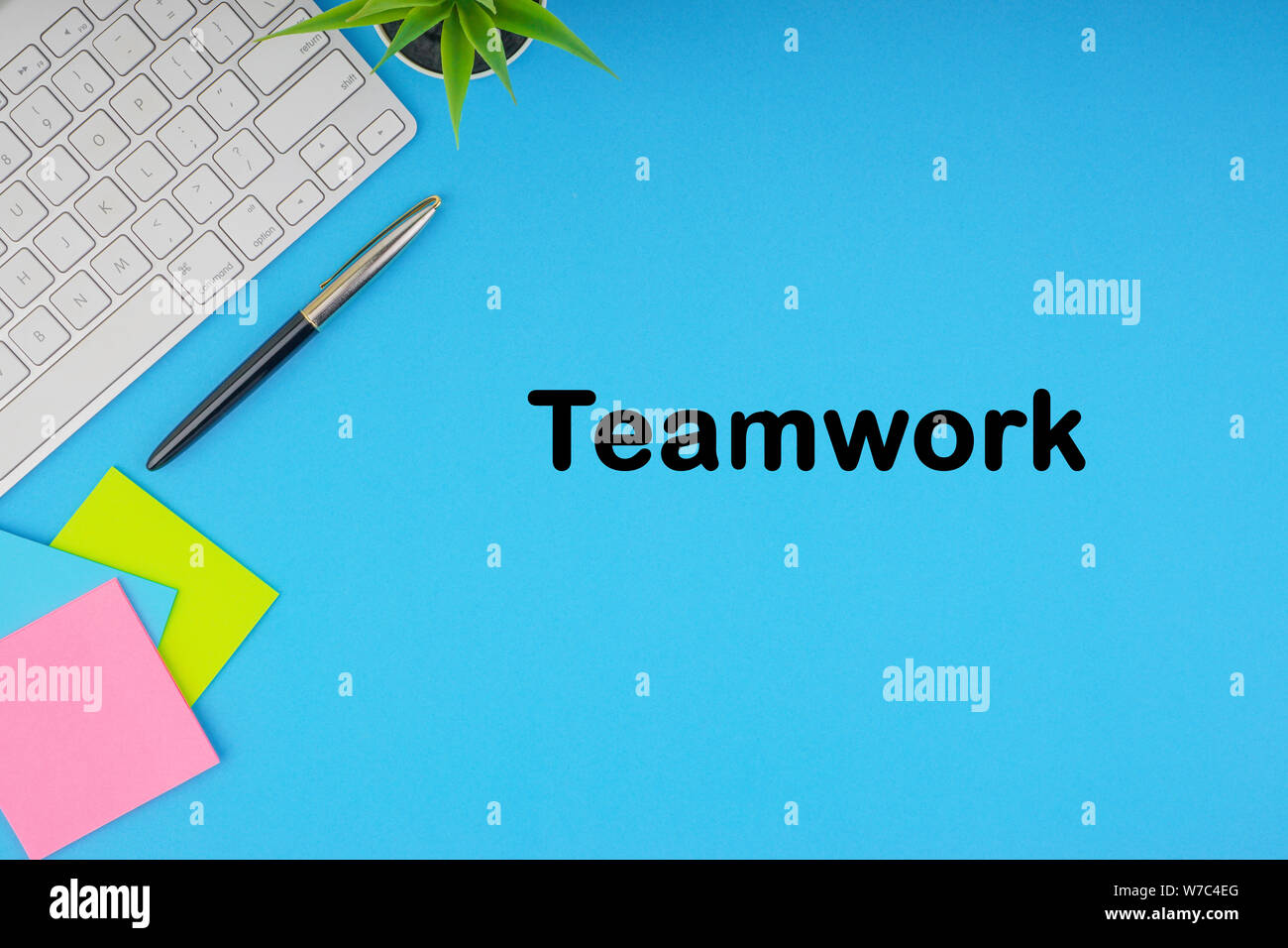 Flat lay, top view office table desk. Workspace with TEAMWORK ...