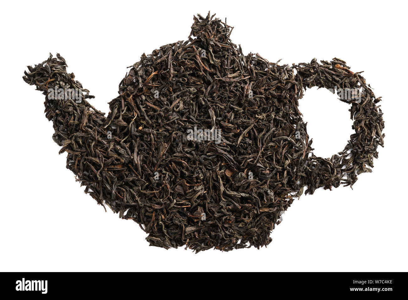 Teapot shape made of dry black tea leaves. Isolated Stock Photo Alamy