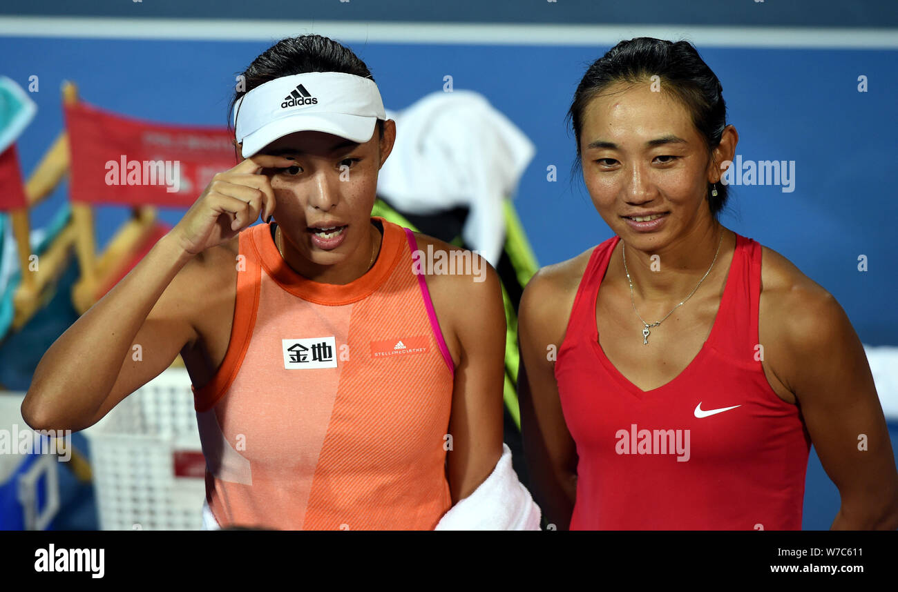 Wang Qiang, left, and Lu Jiajing of China are interviewed by journalists after losing the final match of women's doubles against Chan Hao-Ching and Ch Stock Photo
