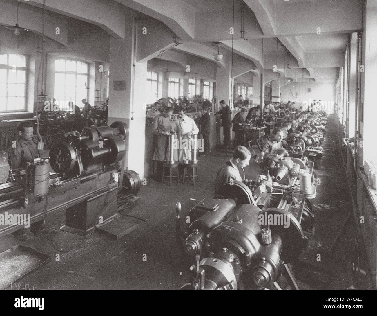 Lens Processing at the Factory of the Optical Mechanical Association in Petersburg, 1916. Artist: Anonymous Stock Photo