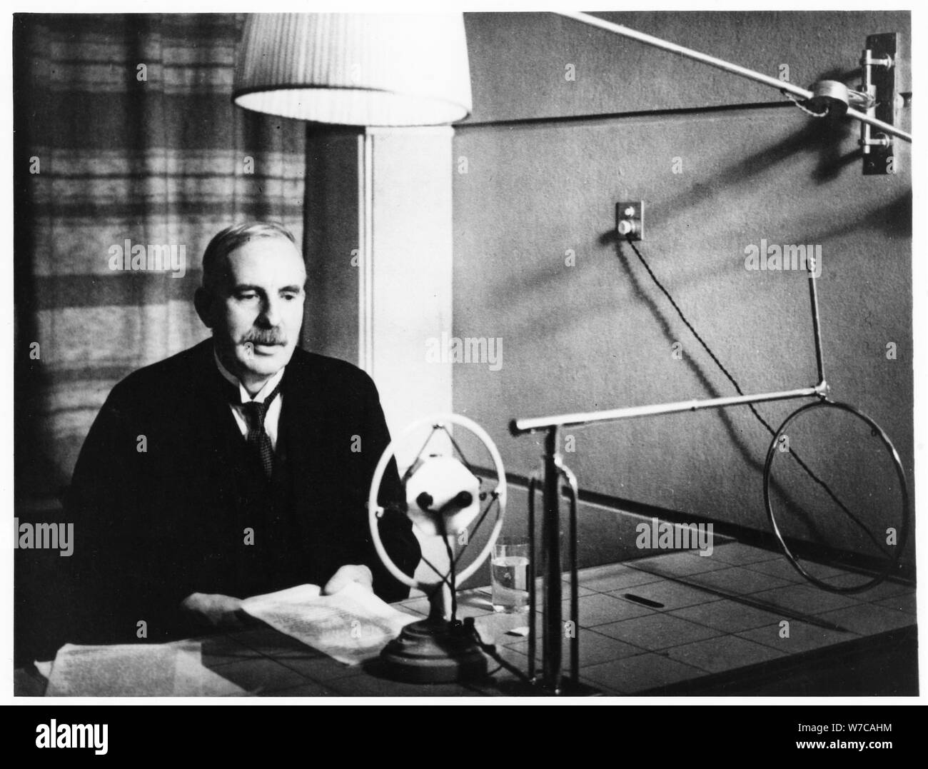 Ernest Rutherford broadcasting during a home visit to New Zealand in 1926.   Artist: Anon Stock Photo