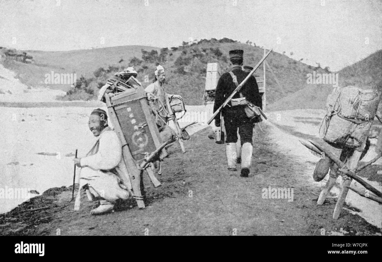 Korean coolies acting as porters for Japanese soldiers, Russo-Japanese War, 1904-5. Artist: Unknown Stock Photo