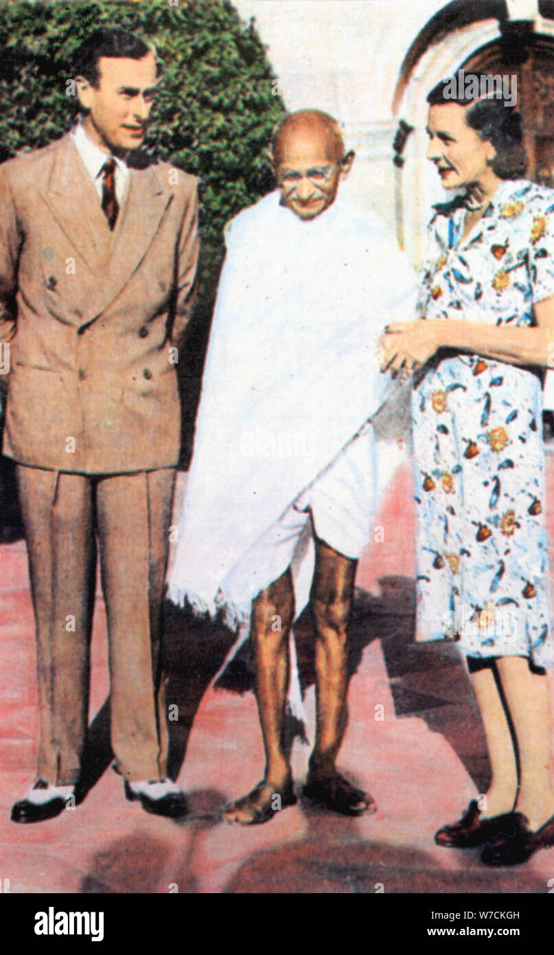 Mohondas Karamchand Gandhi (1869-1948), standing between Lord and Lady Mountbatten. Artist: Unknown Stock Photo