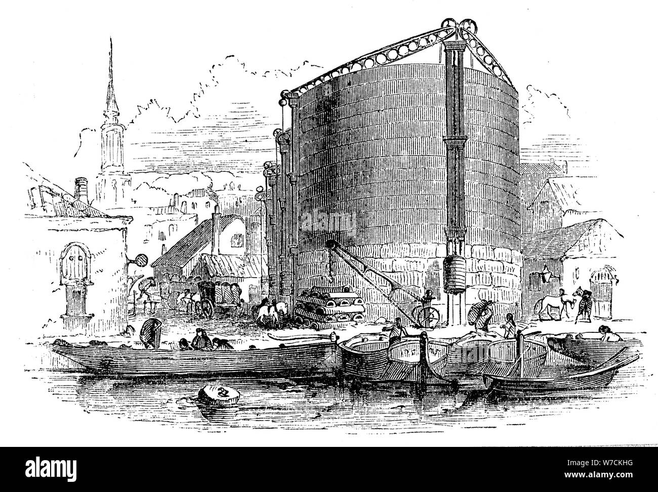 Exterior view of City of London Gasworks, showing gasometers and coal barges at the quay, 1876. Artist: Unknown Stock Photo