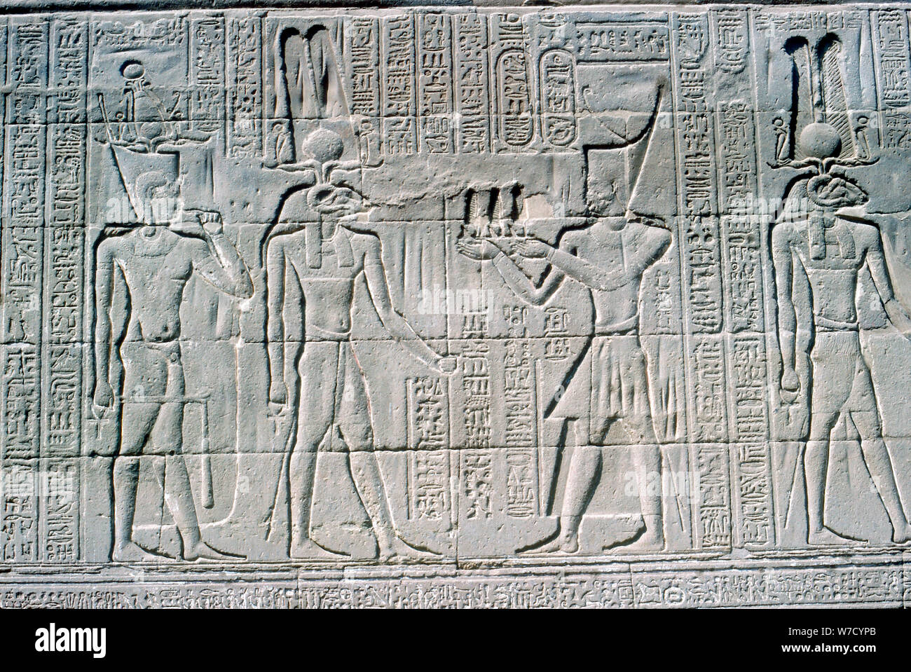 Relief of the Pharaoh before Knum, Temple of Khnum, Ptolemaic & Roman Periods. Artist: Unknown Stock Photo