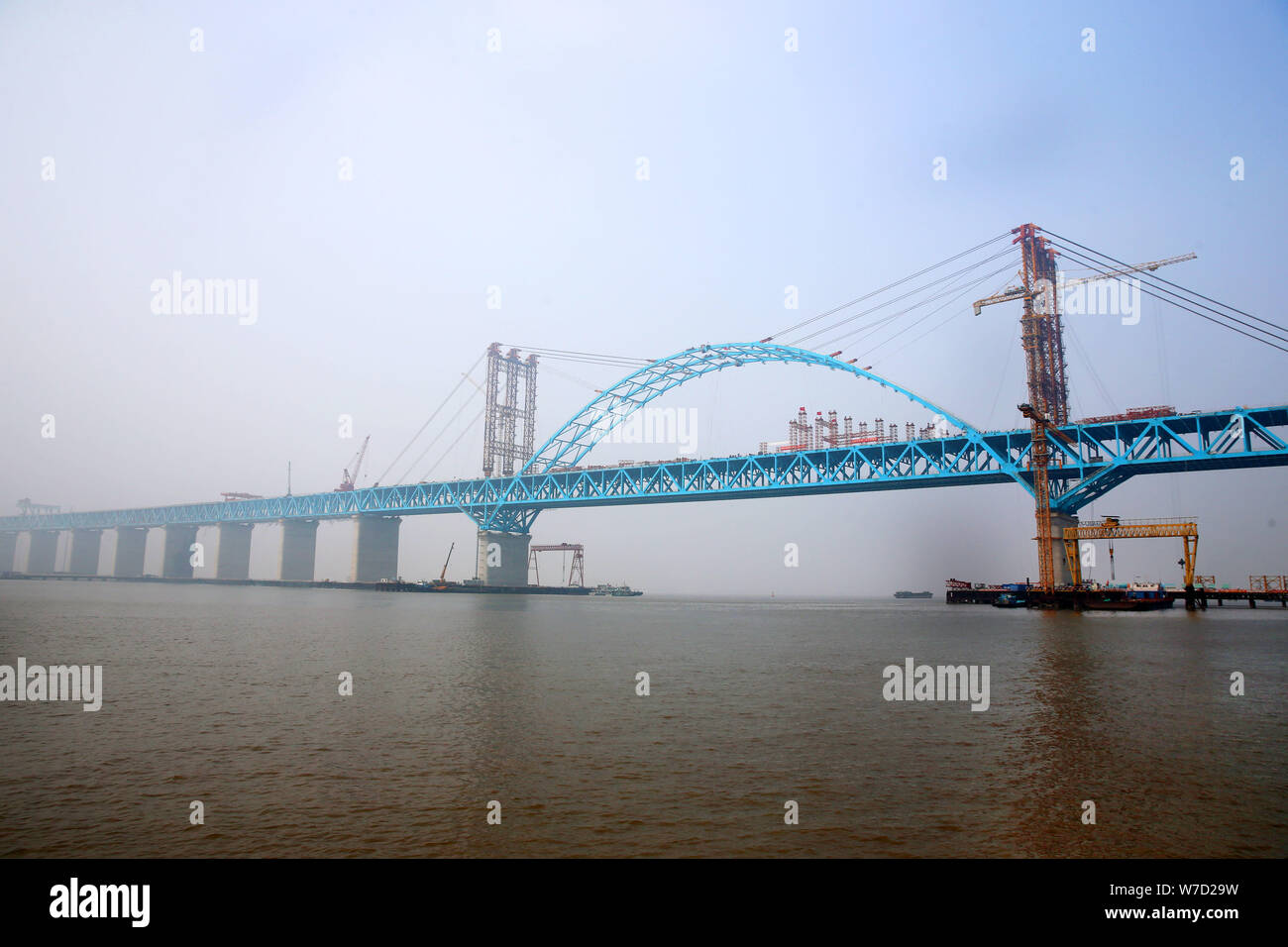 The main arch part of world's longest cable-stayed bridge, the Hutong Railway Yangtze River Bridge, is linked up at the section of Tiansheng Port Area Stock Photo