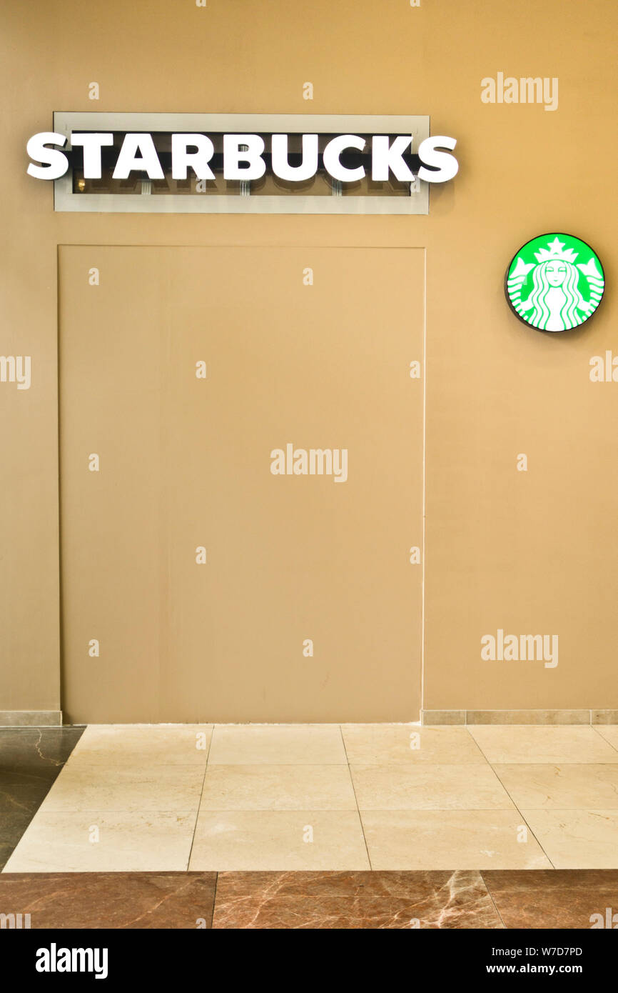 coffeehouse chain Starbucks and logo Stock Photo