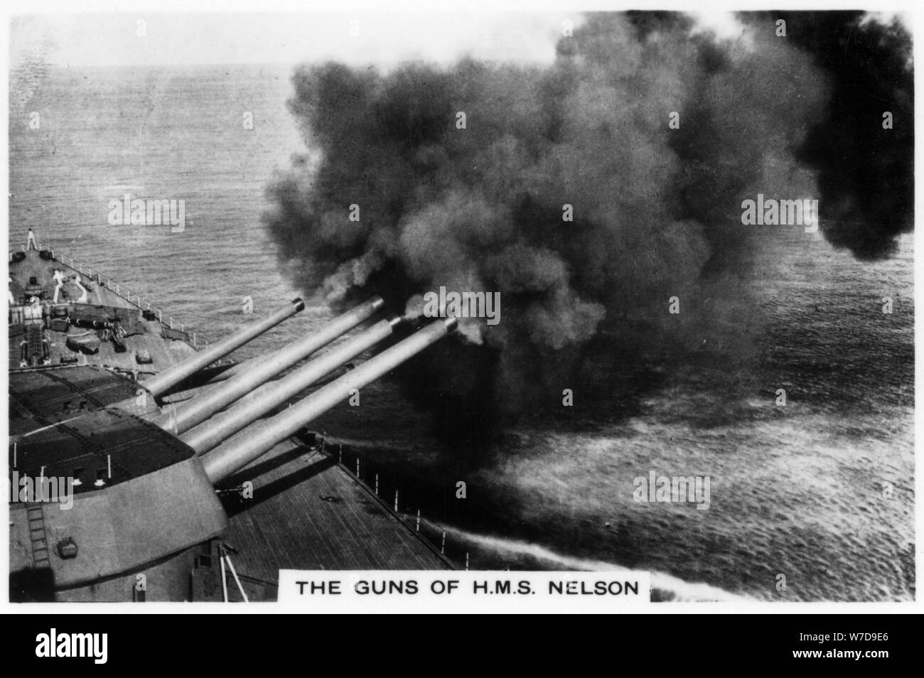 The guns of the battleship HMS 'Nelson' firing, 1937. Artist: Unknown Stock Photo