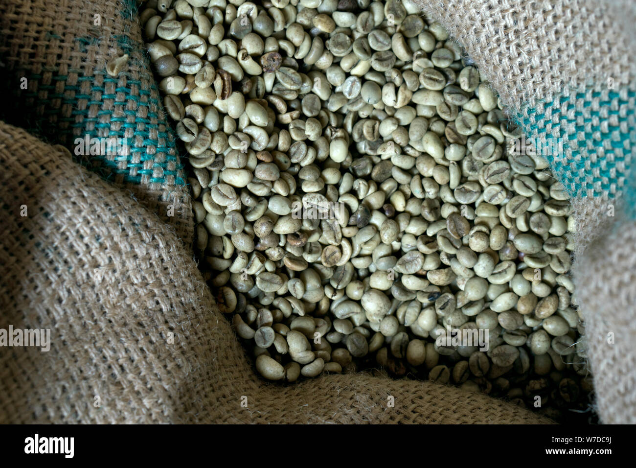 Green coffee bean raw in sack with scoop Stock Photo - Alamy