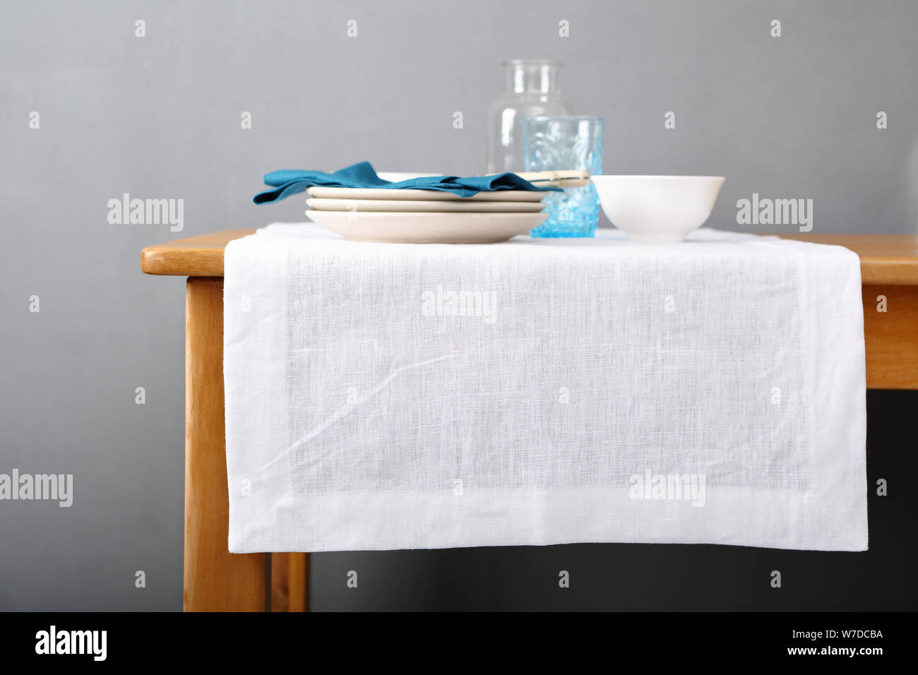 White tables clothes on wood table Stock Photo