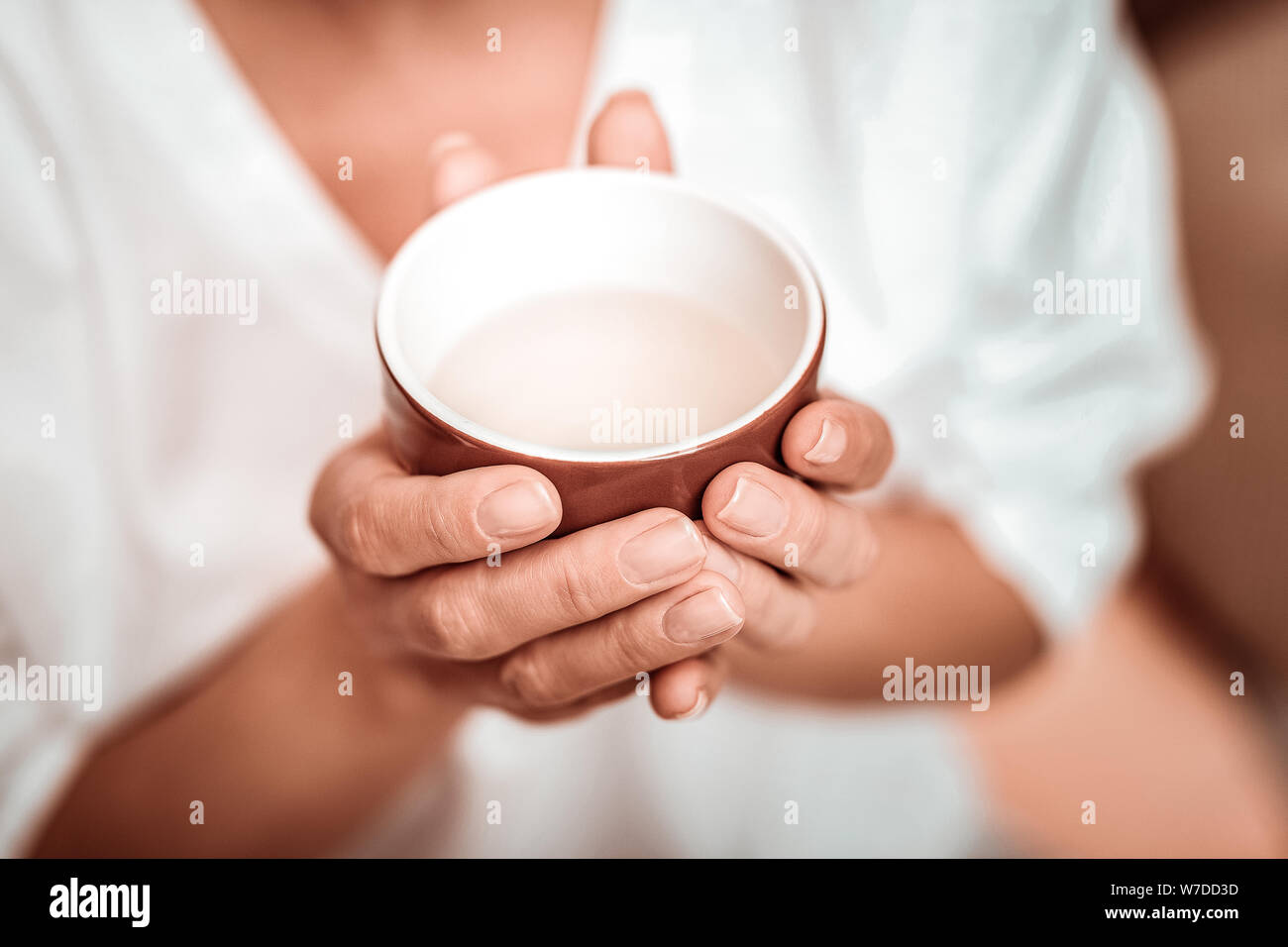 Cup of fragrant herbal tea before drinking. Stock Photo