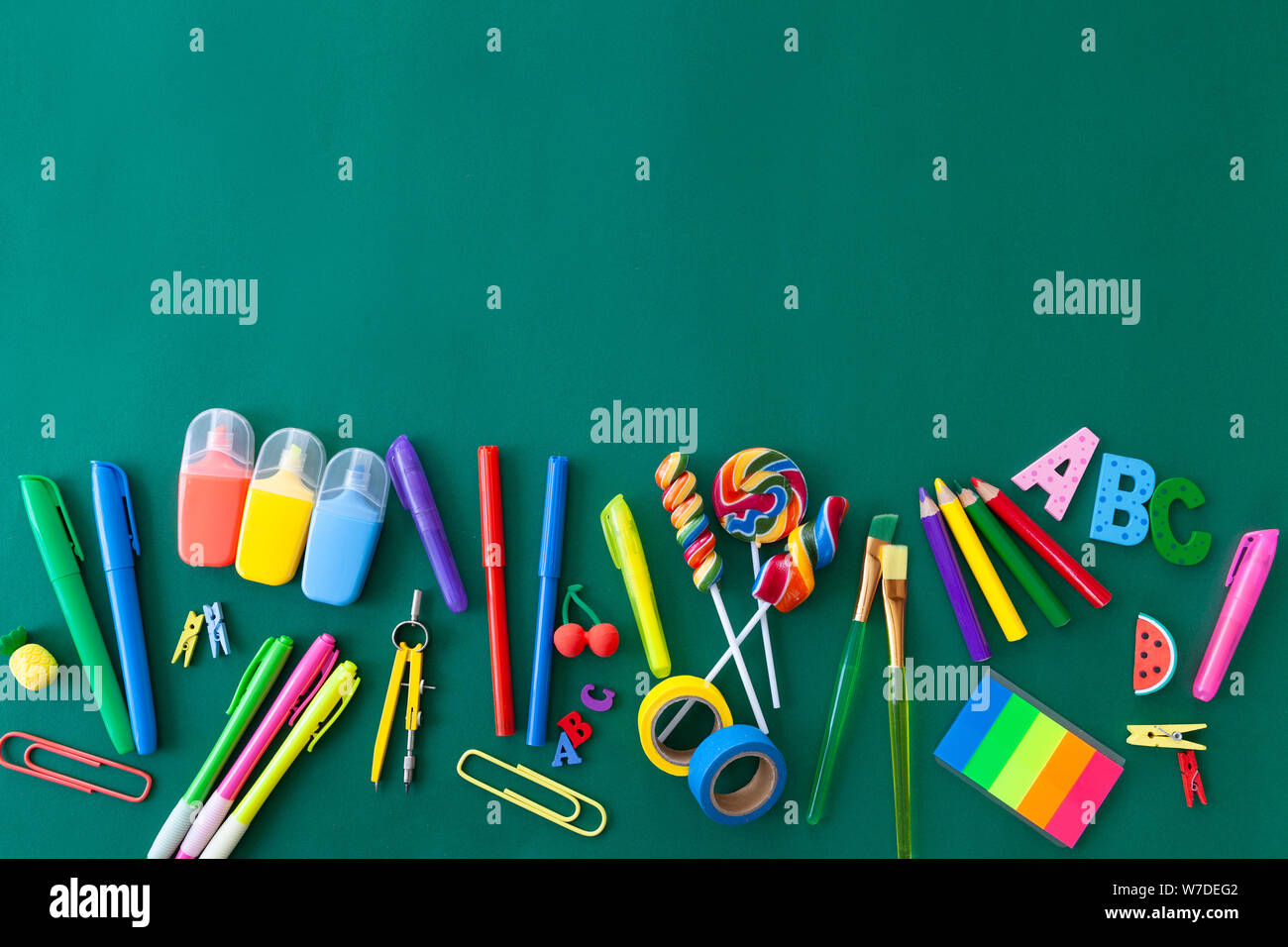 Cheerful colorful background with school and offlice supplies Stock Photo