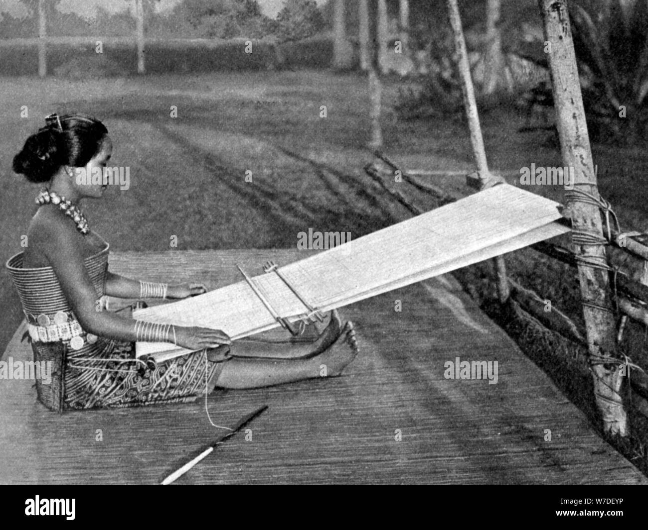 Iban weaver, Borneo, 1922. Artist: Dr Charles Hose Stock Photo