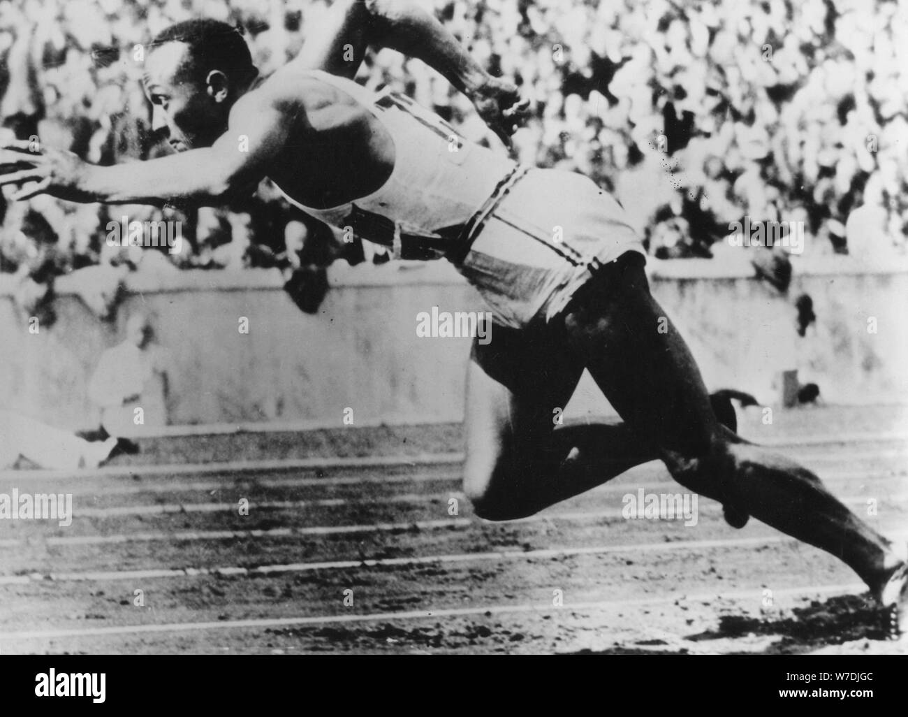 Jesse Owens, American athlete, competing in the Olympics in Berlin, Germany, 1936. Artist: Unknown Stock Photo