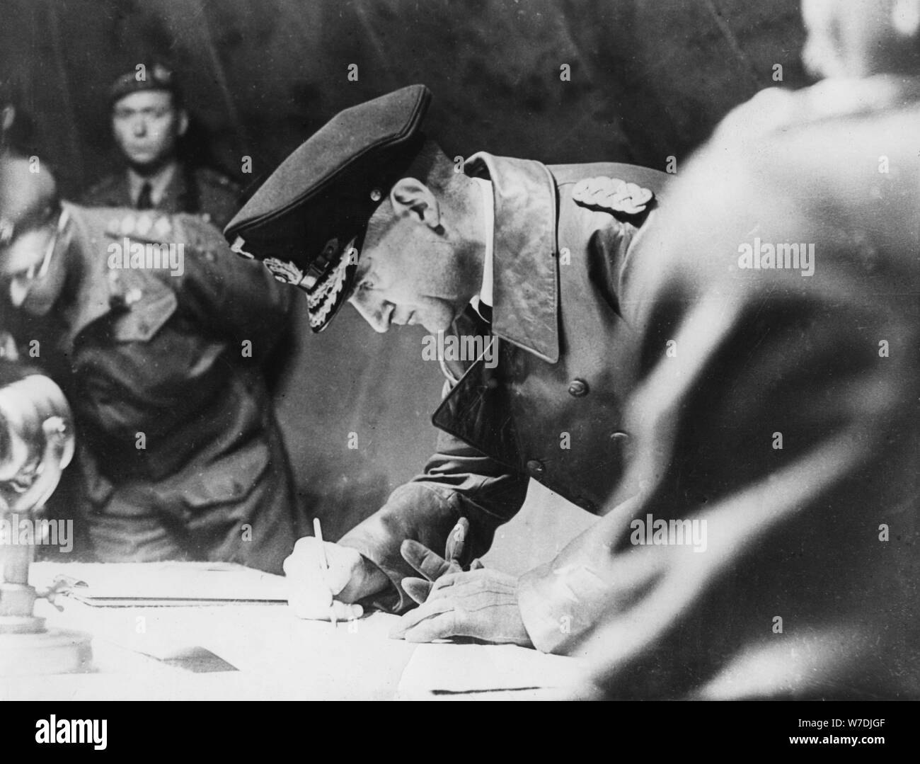 Rear-Admiral Gerhard Wagner signing the German surrender document ending World War II, 1945. Artist: Unknown Stock Photo