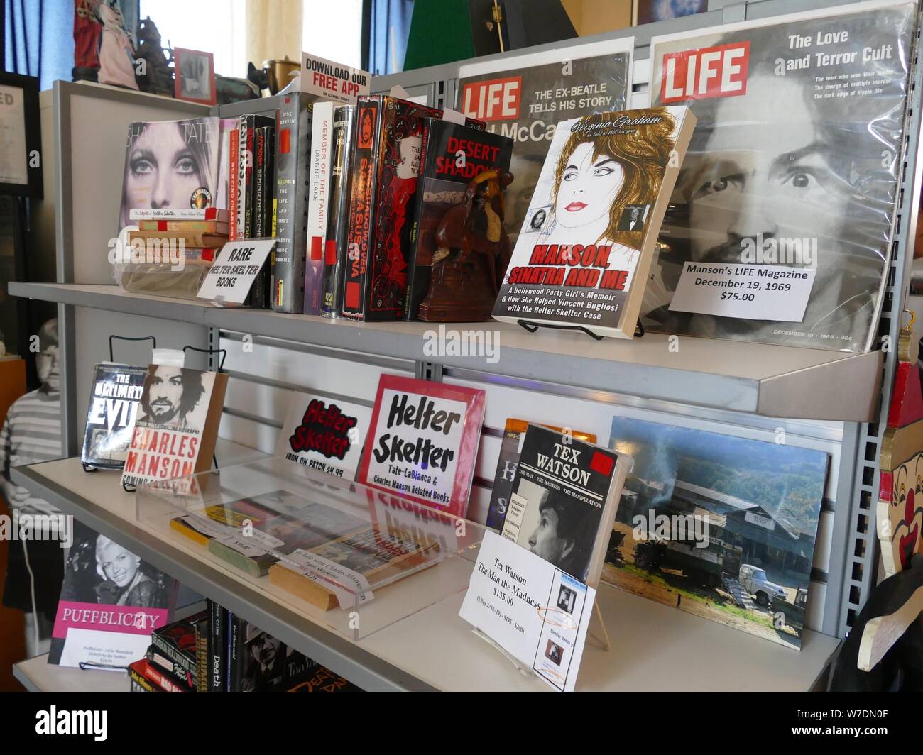 Los Angeles, USA. 03rd Aug, 2019. Exhibits, including books and posters on Charles Manson's series of murders and his followers, are on display in the small museum of 'Dearly Departed Tours'. A barbaric series of murders scared the world 50 years ago. Sect leader Charles Manson incited his followers to blood orgies. In 1969 also the highly pregnant actress Sharon Tate was killed. (to dpa '50 Years after the Manson Bloodbath: On the Trails of Sharon Tate') Credit: Barbara Munker/dpa/Alamy Live News Stock Photo