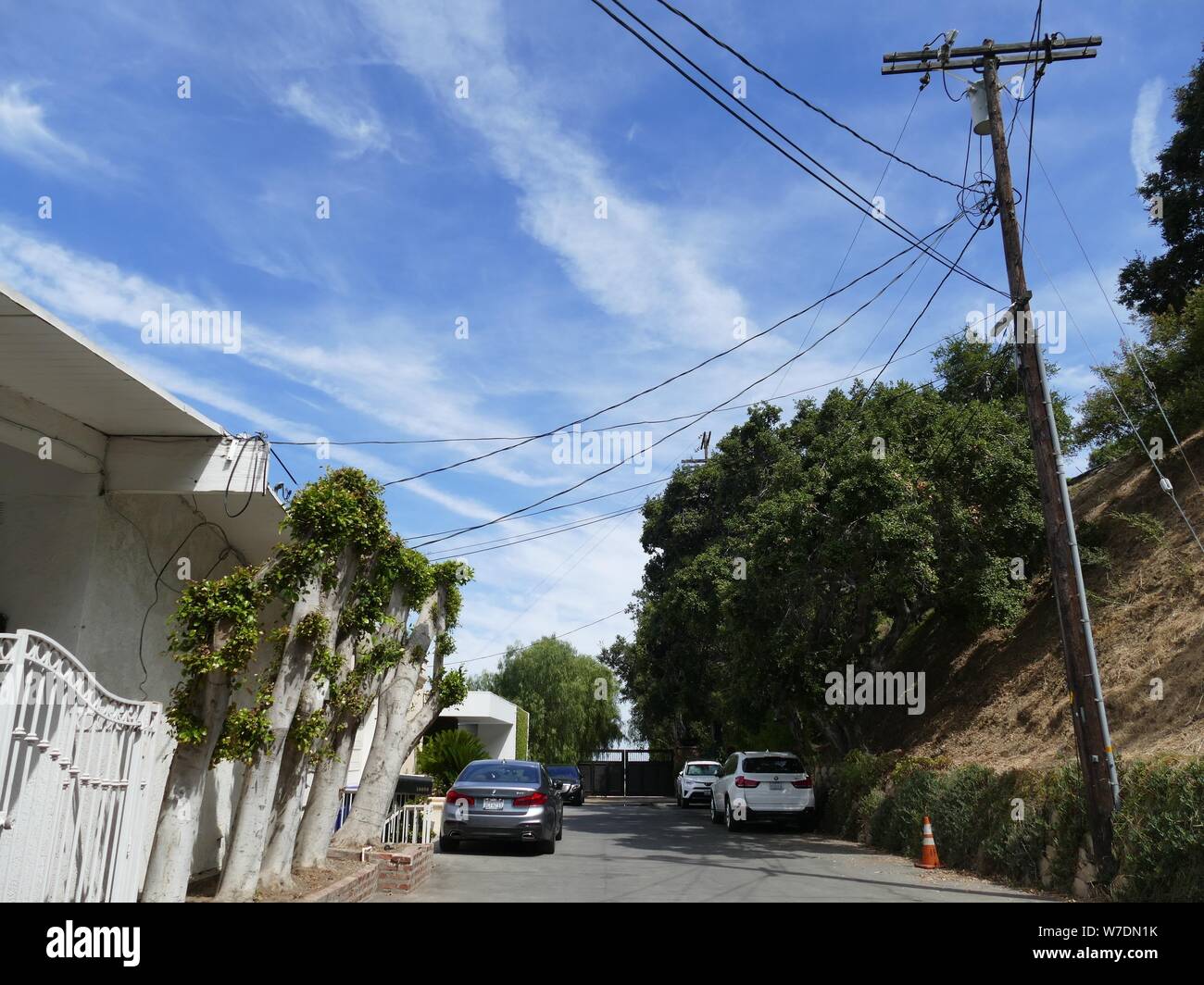Los Angeles, USA. 03rd Aug, 2019. View into the Cielo Drive. The gate at the end of the cul-de-sac leads to the former property of the house where the actress Sharon Tate was murdered. A barbaric series of murders scared the world 50 years ago. Sect leader Charles Manson incited his followers to blood orgies. In 1969 also the highly pregnant actress Sharon Tate was killed. (to dpa '50 Years after the Manson Bloodbath: On the Trails of Sharon Tate') Credit: Barbara Munker/dpa/Alamy Live News Stock Photo