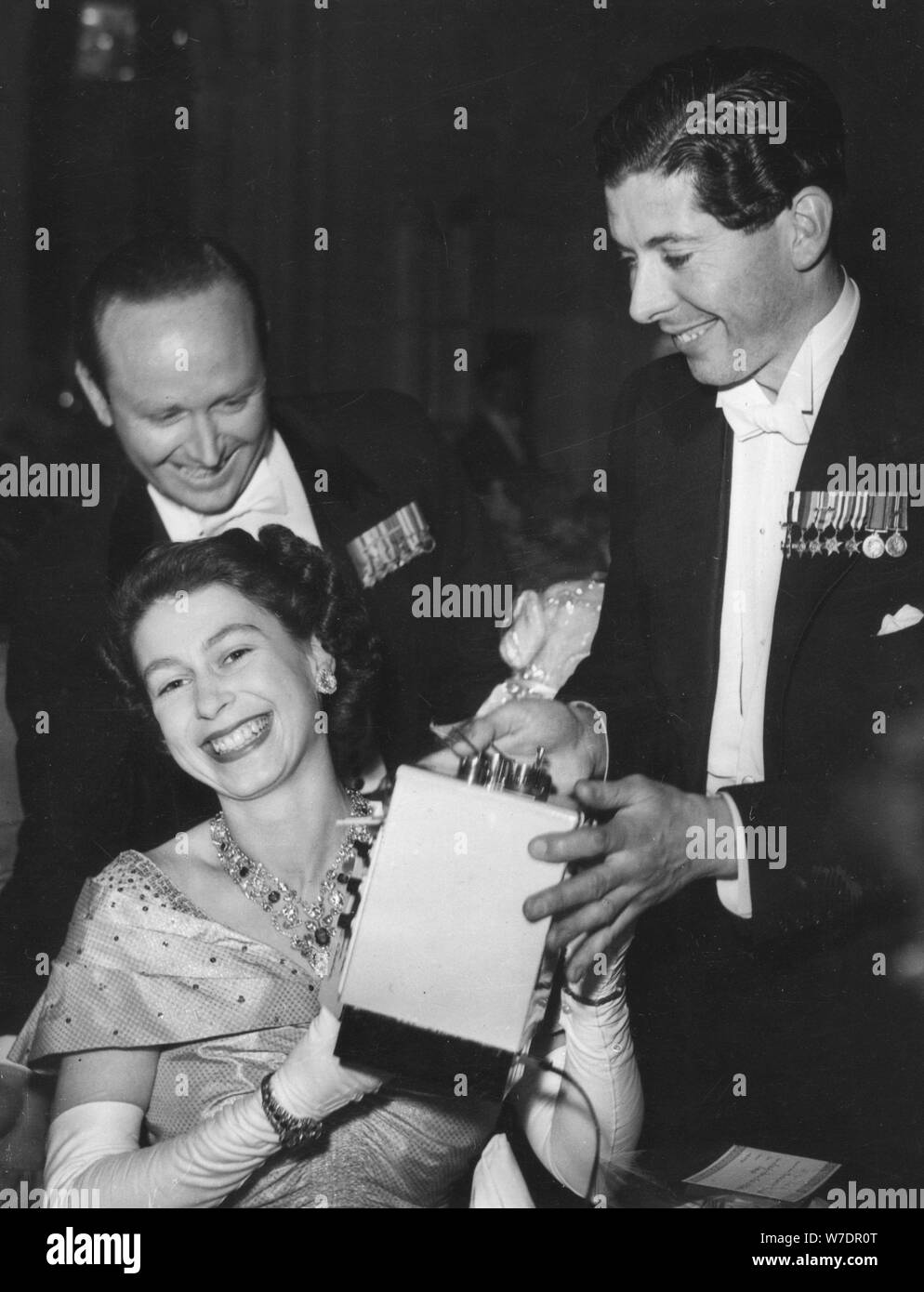 Princess Elizabeth receives a toy stove for Prince Charlesat the Flower Ball, Savoy Hotel, 1951. Artist: Unknown Stock Photo