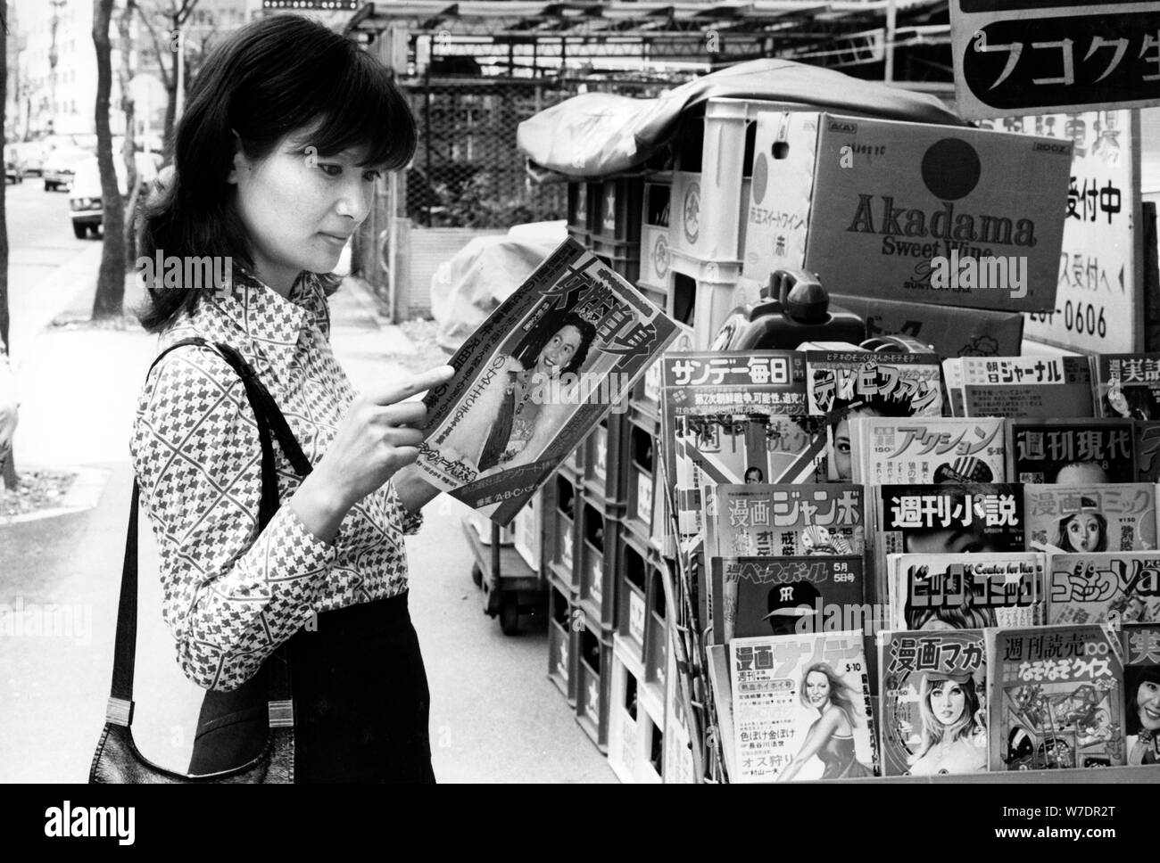 A woman buying a magazine, Tokyo, Japan, 1975. Artist: Unknown Stock Photo
