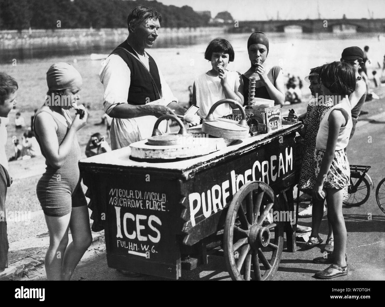 Ice cream man by the Thames at Putney, London, c1932. Artist Unknown