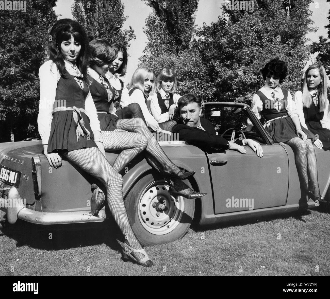 Frankie Howerd and some of the girls from St Trinian's at Shepperton Studios, Surrey, c1966. Artist: Unknown Stock Photo