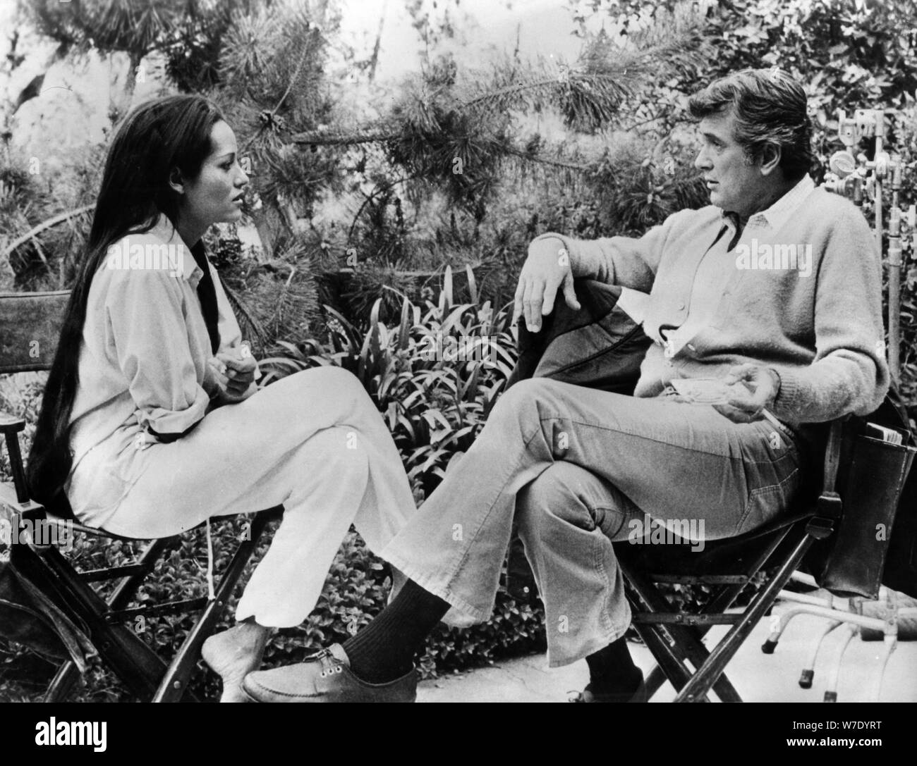 Rock Hudson and Barbara Carrera during the filming of 'Embryo', 1976.  Artist: Unknown Stock Photo - Alamy