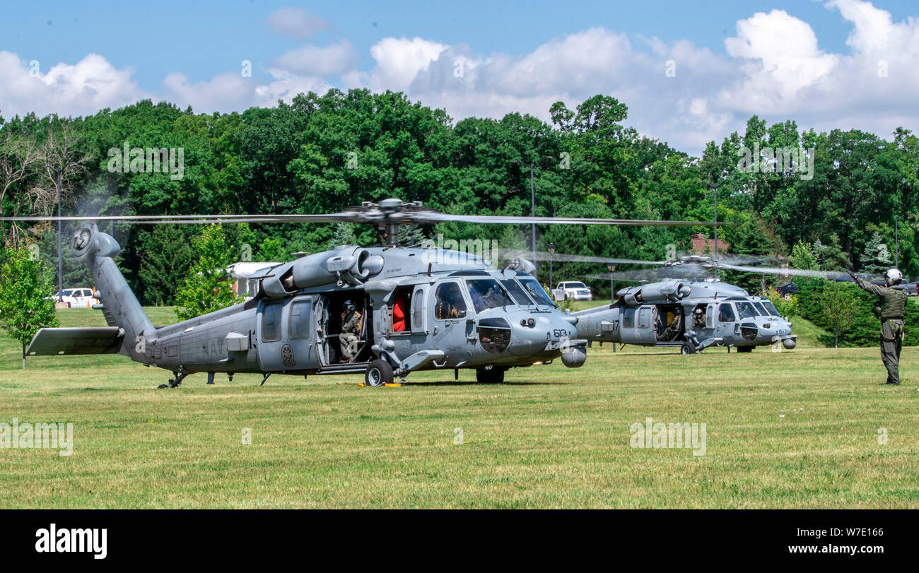 190802-N-PL946-2109 GREAT LAKES, Ill. (Aug. 2, 2019) Two MH-60S Seahawk helicopters from the Helicopter Sea Combat Squadron Four (HSC-4) “Black Knights,” stationed in San Diego, sit on one of the lawns at Recruit Training Command to meet with and commission their sponsored recruit division. More than 35,000 recruits train annually at the Navy's only boot camp. (U.S. Navy photo by Mass Communication Specialist 1st Class Spencer Fling/Released) Stock Photo