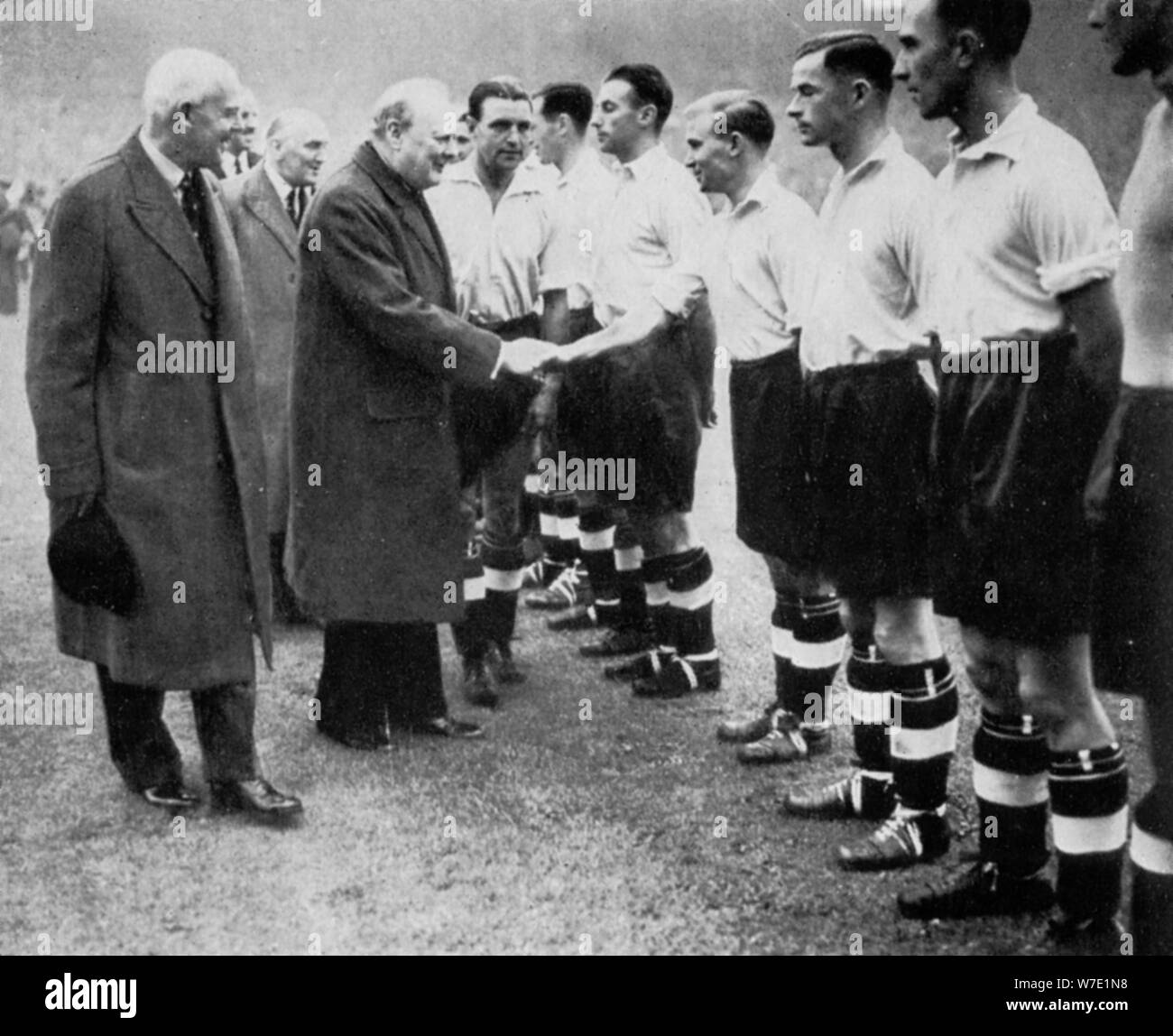 Winston Churchill greets the England football team, Wembley, London, October 1941.Artist: London News Agency Stock Photo