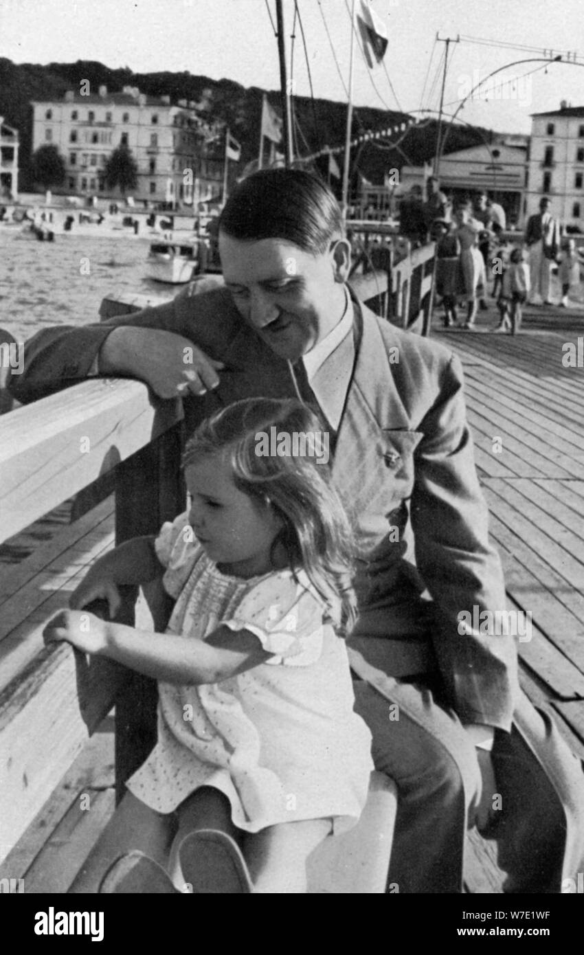 Adolf Hitler and Helga Goebbels, 1936. Artist: Unknown Stock Photo