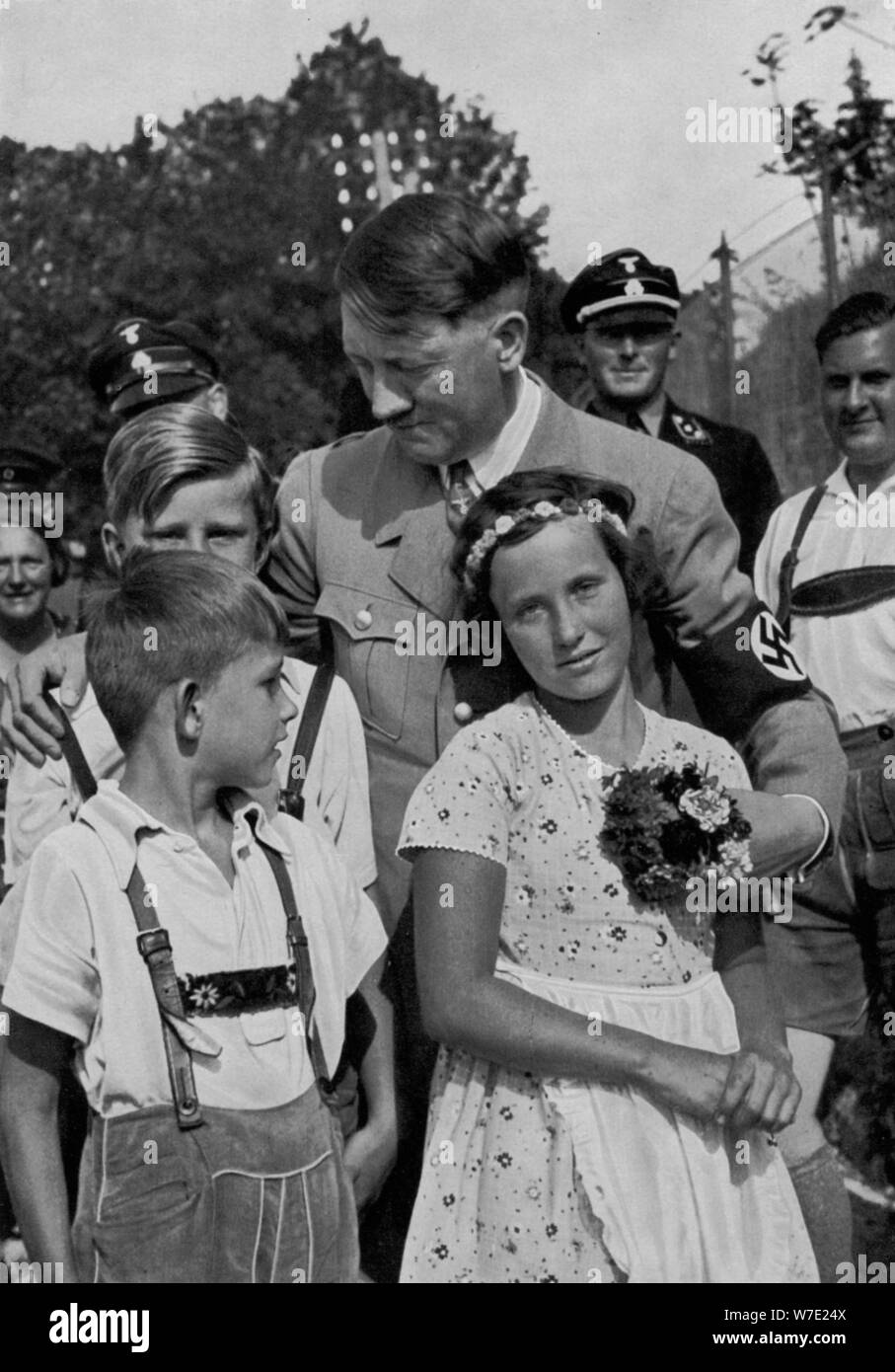 adolf-hitler-with-a-group-of-young-children-1936-artist-unknown-W7E24X.jpg