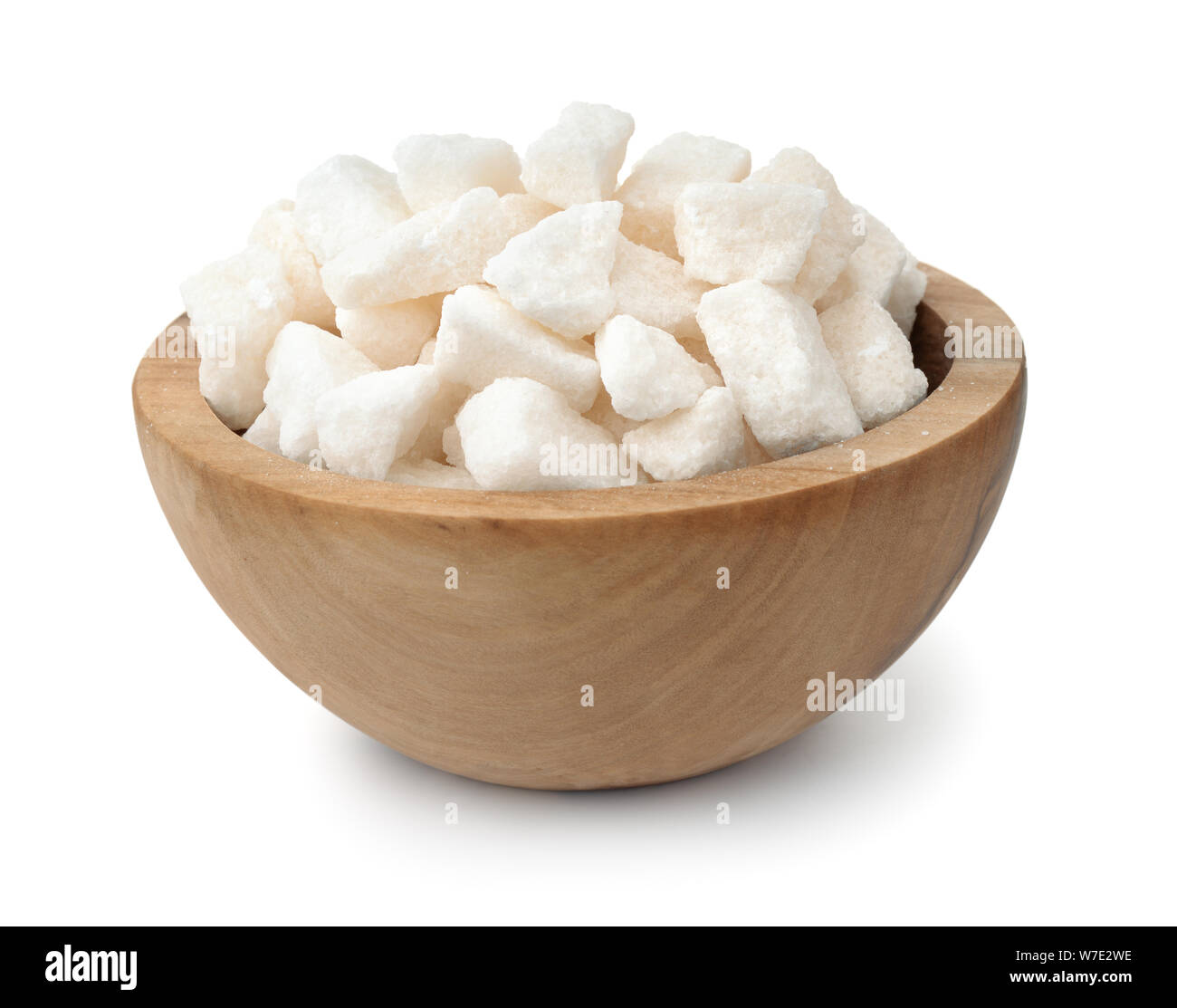 Organic crushed lump sugar in wooden bowl isolaed on white Stock Photo