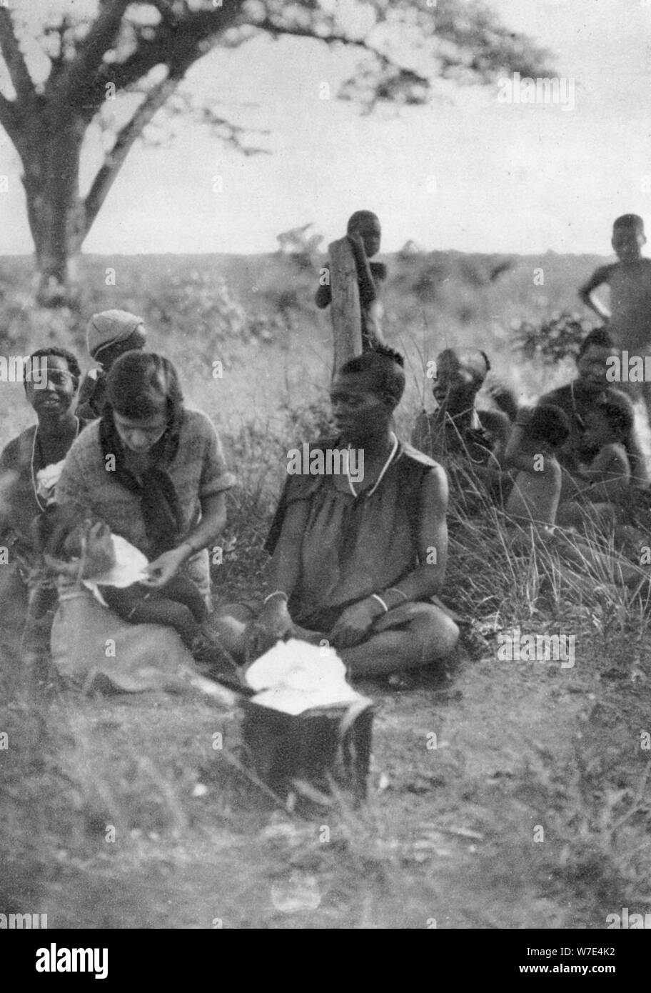 Stella Court Treatt tending a sick baby, Bulawayo to Dett, Southern Rhodesia, c1924-c1925 (1927). Artist: Thomas A Glover Stock Photo