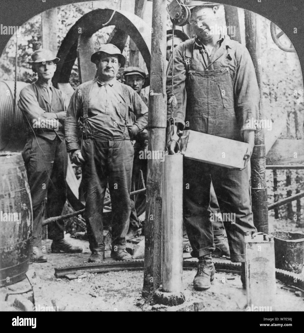 Filling a shell with nitro-glycerine, oil field in Pennsylvania, USA, early 20th century(?). Artist: Keystone View Company Stock Photo
