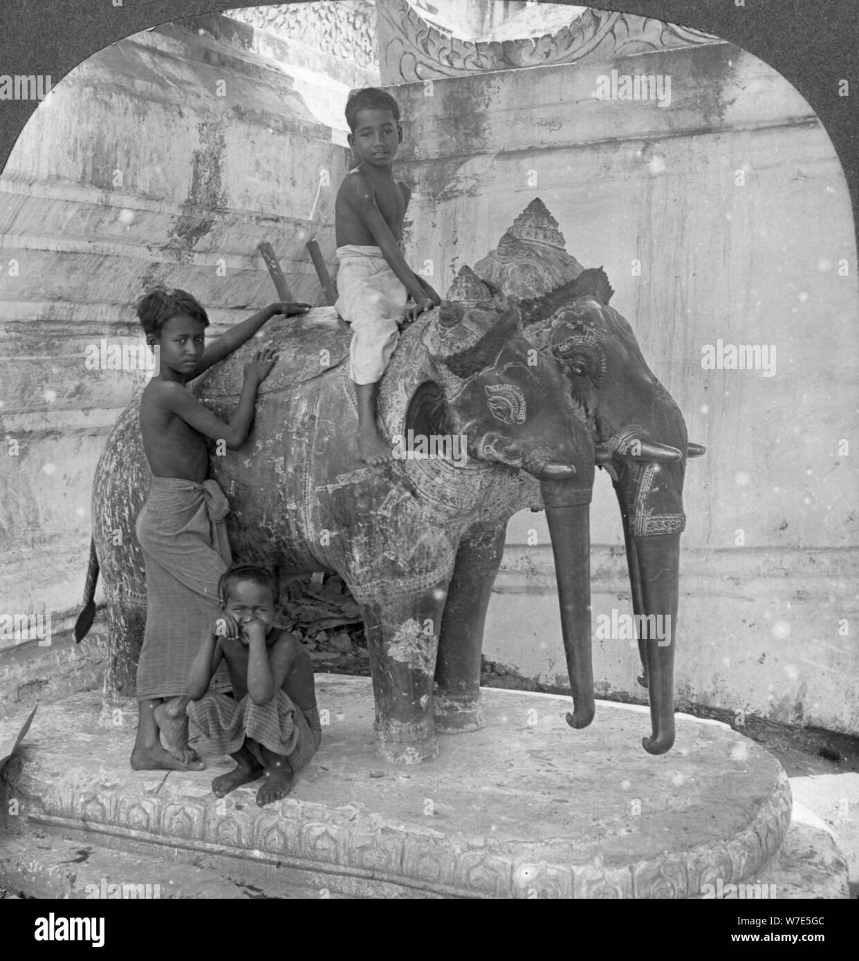 Three headed elephant guarding a sanctuary, Arakan Pagoda, Mandalay, Burma, 1908.  Artist: Stereo Travel Co Stock Photo