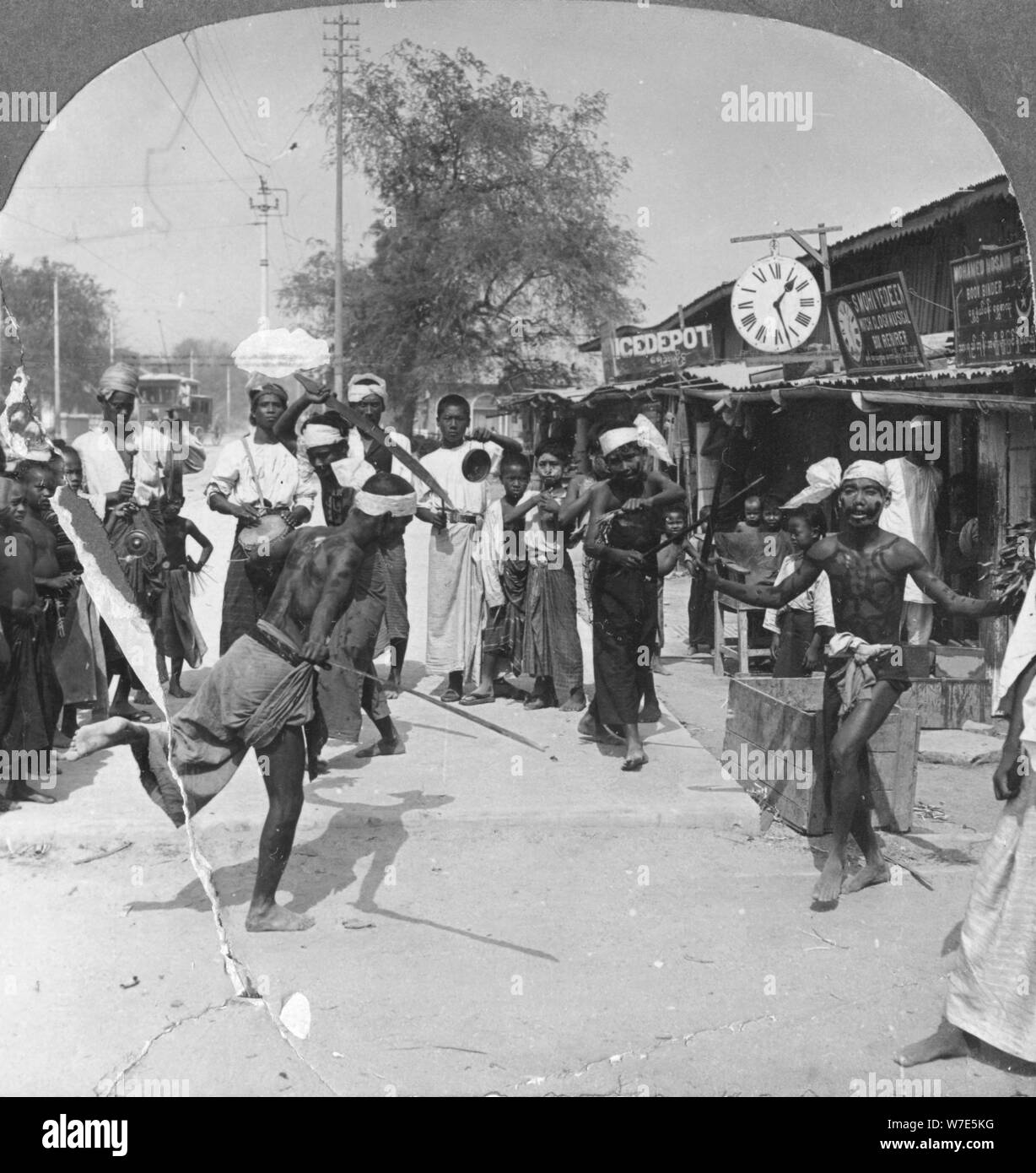 Young men performing a sword dance, Burma, 1908. Artist: Stereo Travel Co Stock Photo
