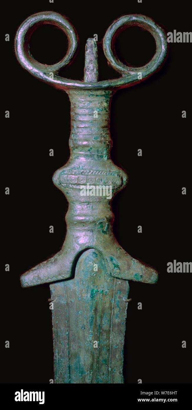 Hilt of an early bronze sword, 7th century BC. Stock Photo